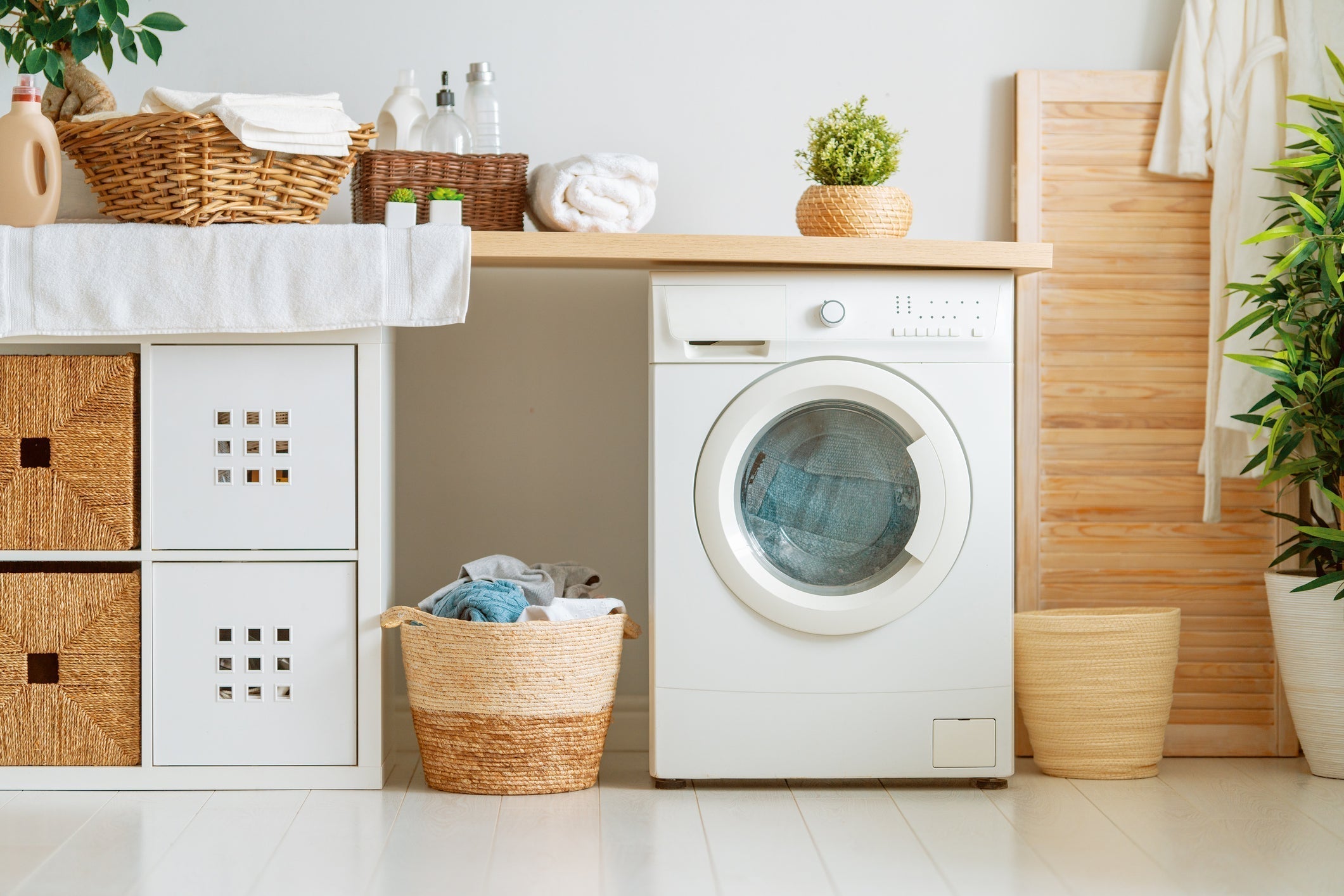Washing Machine in a Bamboo/White Laundry Room 